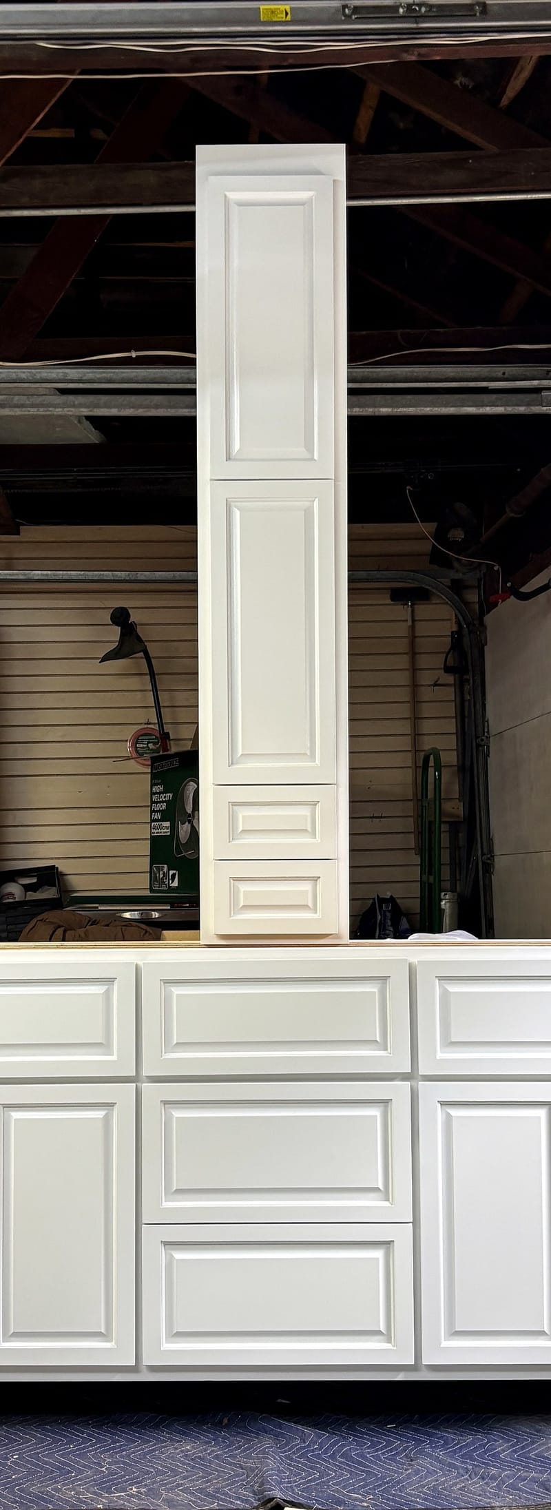 Dorothy's Vanity — shop photo of the white-painted vanity and linen tower, before hardware and countertop — Lyon St Woodworking